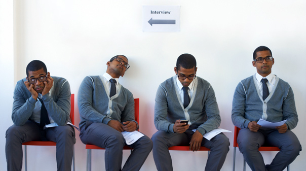 Conceptual image of a young man being kept waiting for an interview