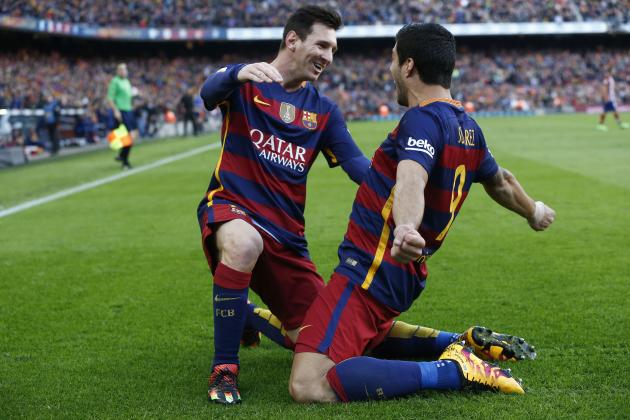 Messi and Suarez enjoying a goal scored by Suarez
